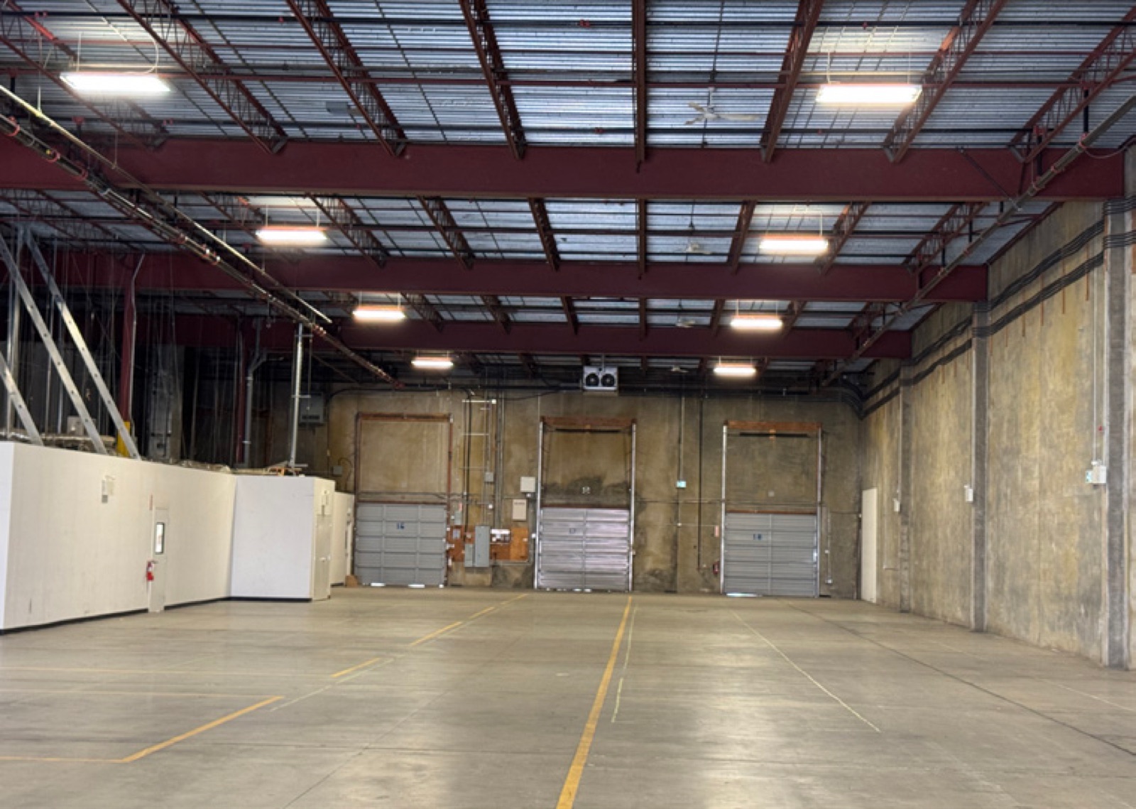 Warehouse interior at 403 East Kent Avenue North looking toward three dock loading doors