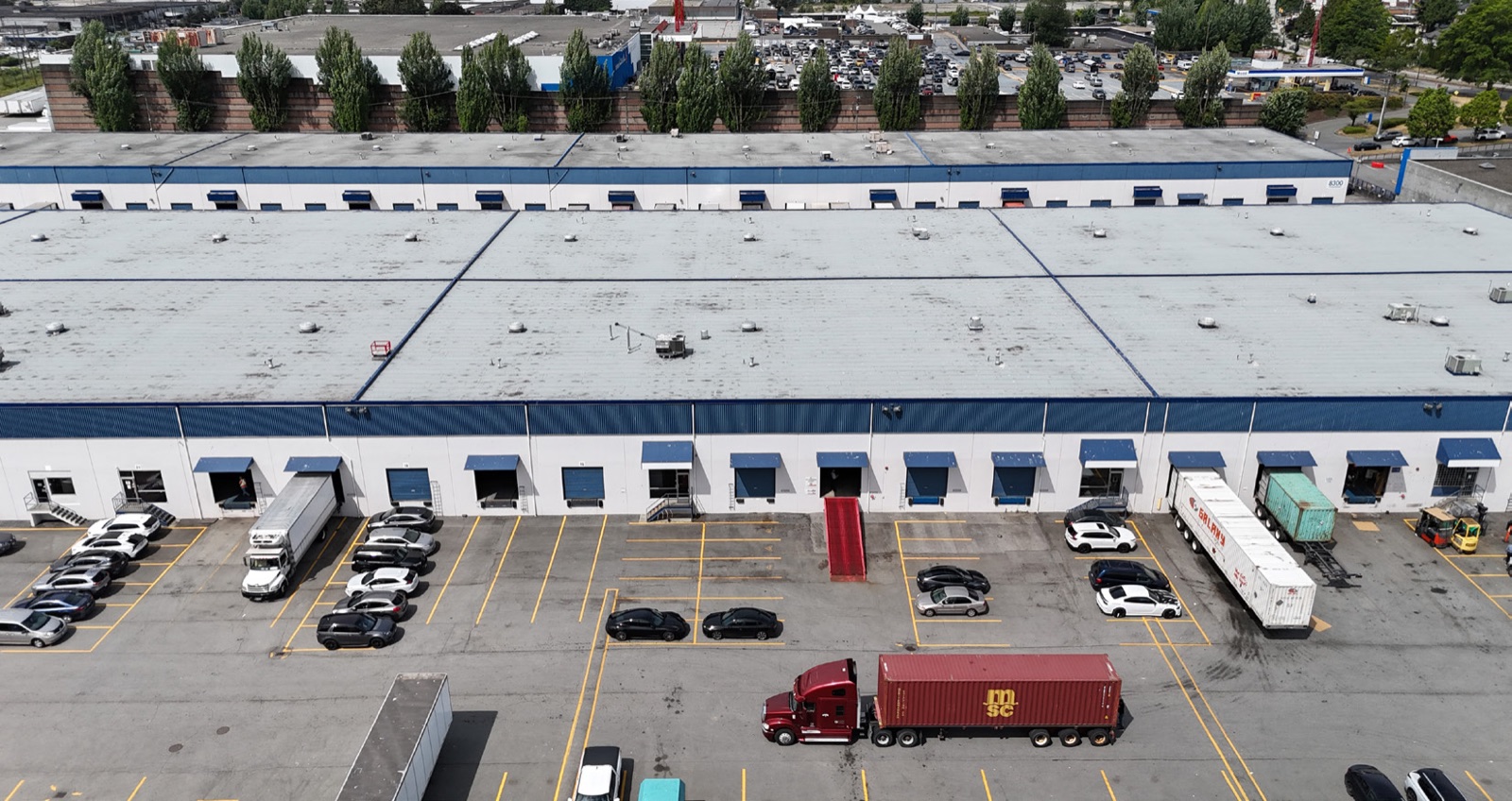 Aerial view of the dock side of Marine Drive Industrial Centre with a container truck at the loading doors