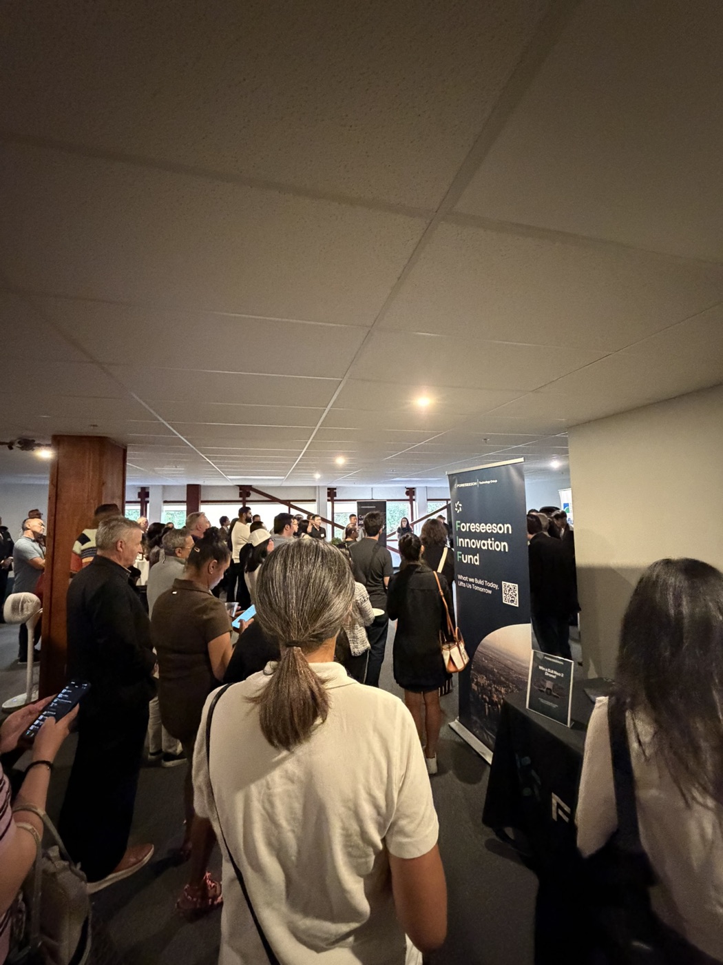 A crowd of Richmond Chamber of Commerce members gathered inside Foreseeson Technology's facility on Jacombs Road, with a Foreseeson Innovation Fund banner in the foreground.
